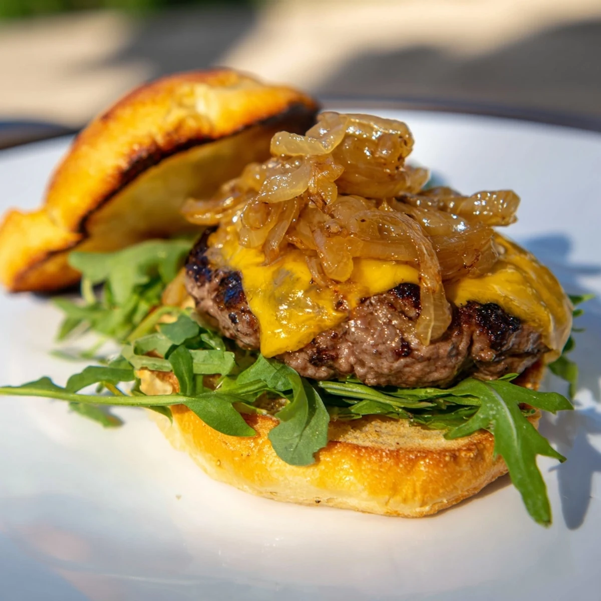 Juicy beef sliders with caramelized onions and cheddar melting on soft buns.