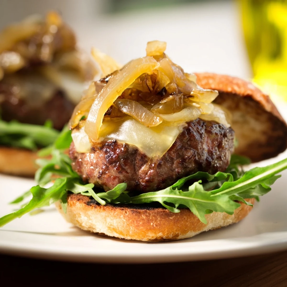 Platter of warm beef sliders with cheddar and sweet onions for game day.