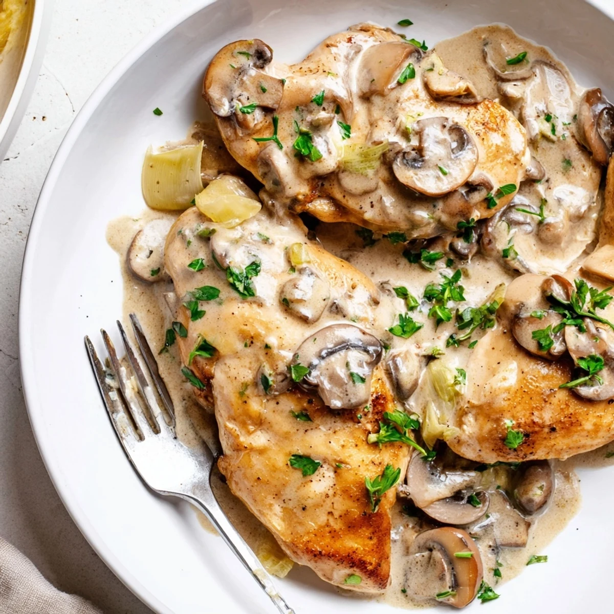 Savory Creamy Mushroom Chicken Skillet with tender chicken and garlic in a rich sauce.