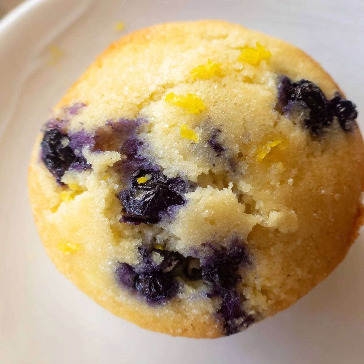 Stack of warm Sourdough Blueberry Muffins on a rustic plate, perfect for an American breakfast spread.