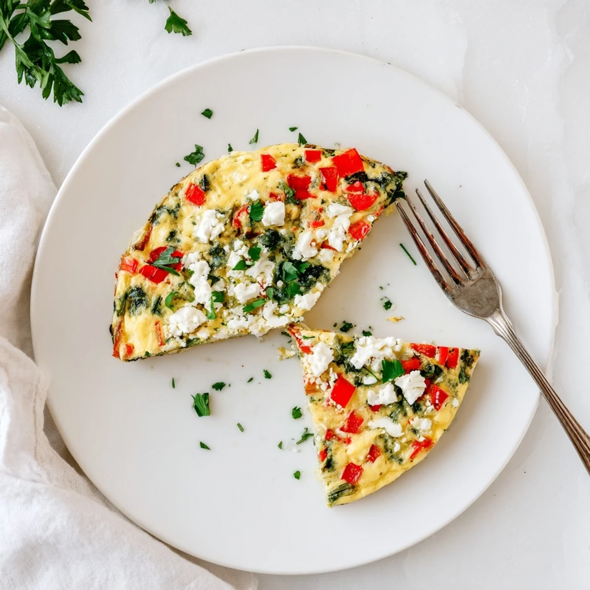 Golden-brown Healthy Lentil and Feta Frittata slices reveal creamy feta and tender lentils atop a rustic wooden table.  