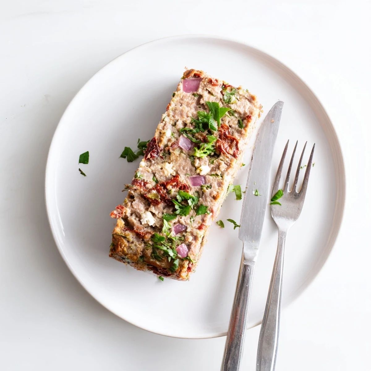 Juicy turkey meatloaf stuffed with feta cheese and sun-dried tomatoes ready to serve