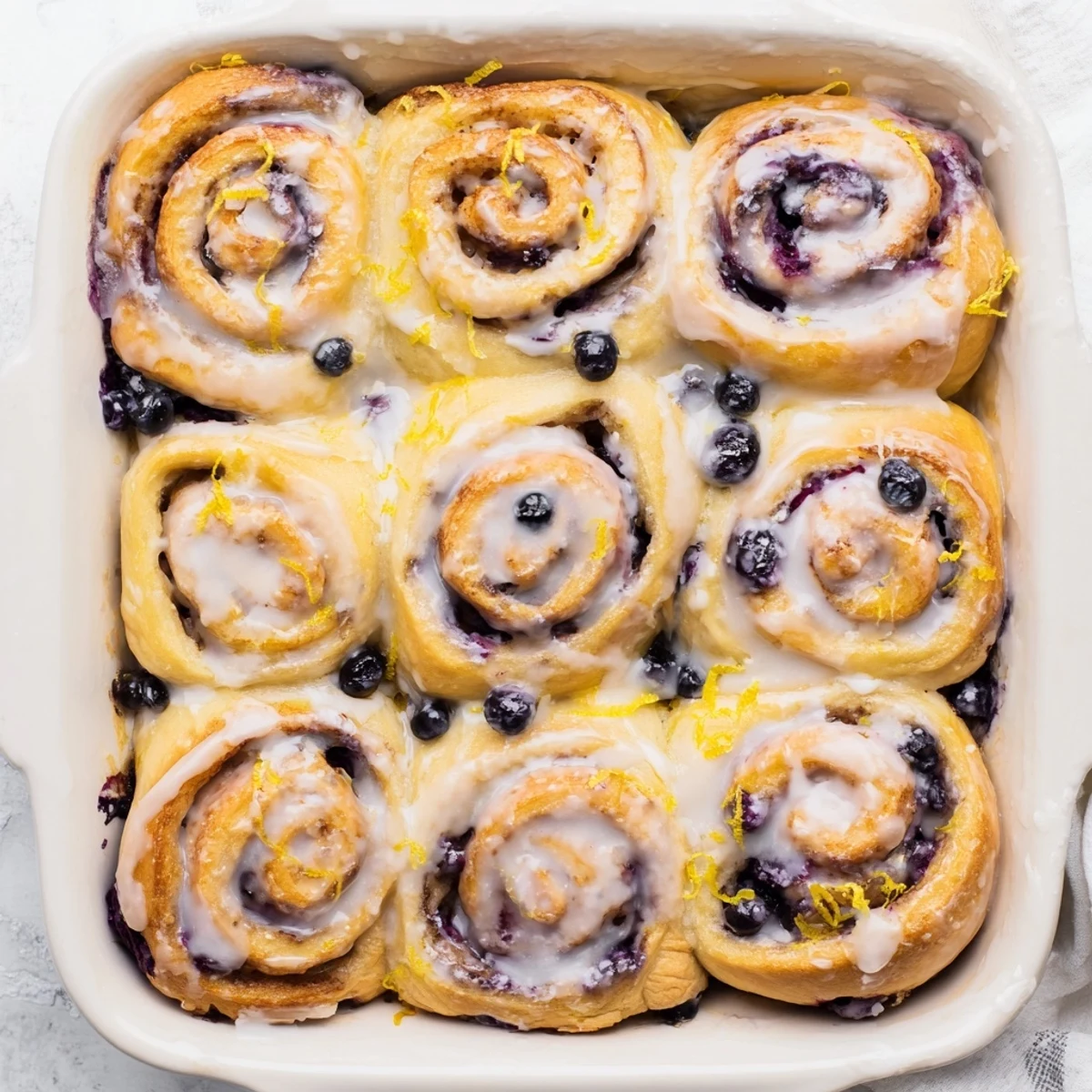 Soft swirled breakfast pastry bursting with tangy lemon and juicy blueberry filling