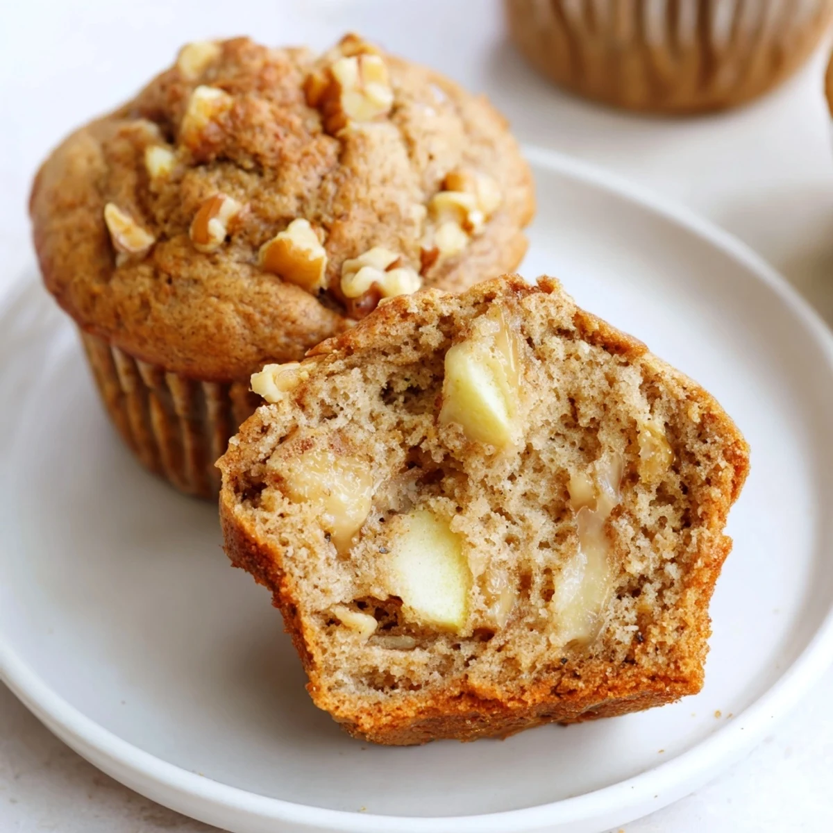Plate of warm muffins: Healthy Apple Cinnamon Greek Yogurt Muffins with honey.