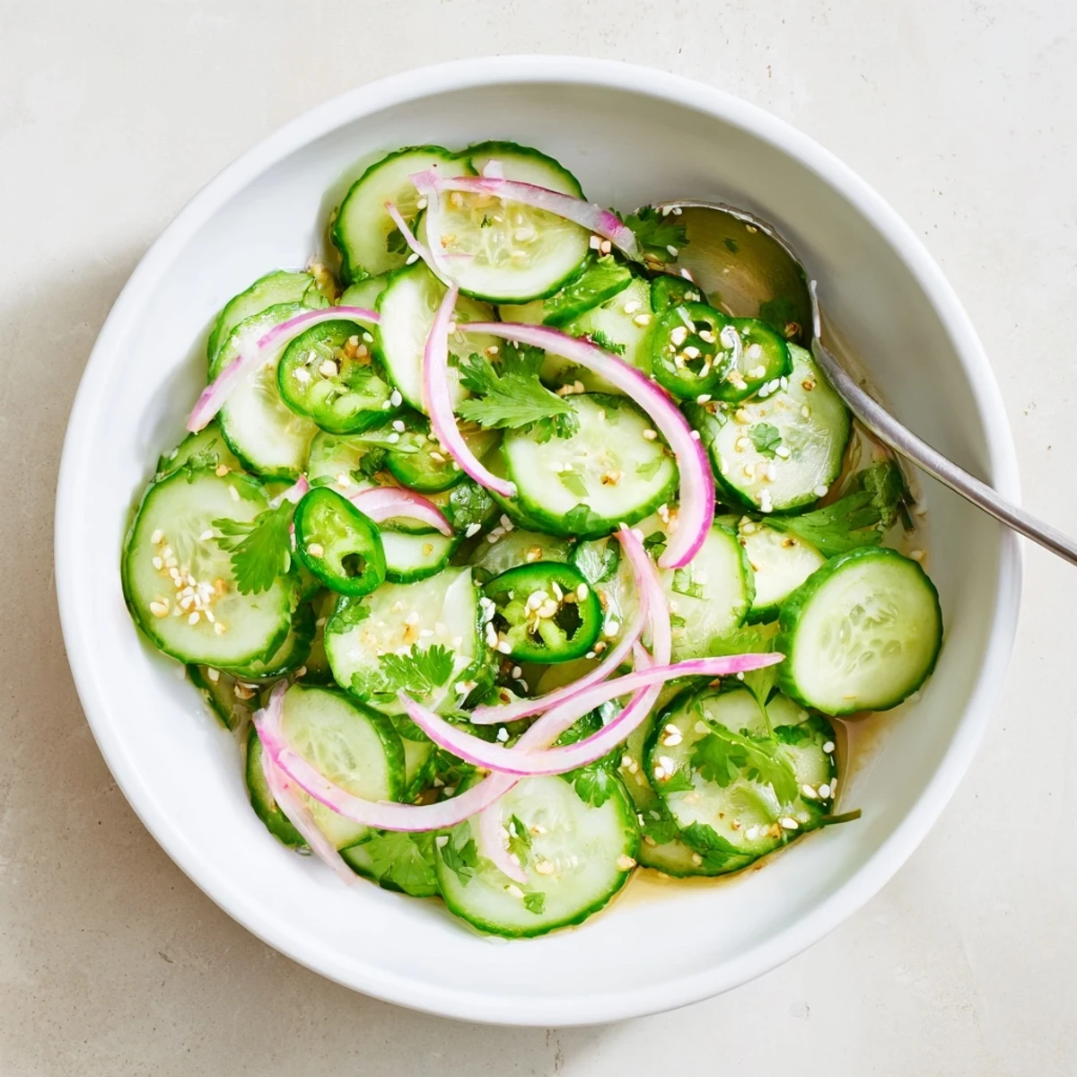 Fresh Honey Lime Cucumber Salad featuring crisp cucumber slices in tangy honey-lime dressing with chopped cilantro.