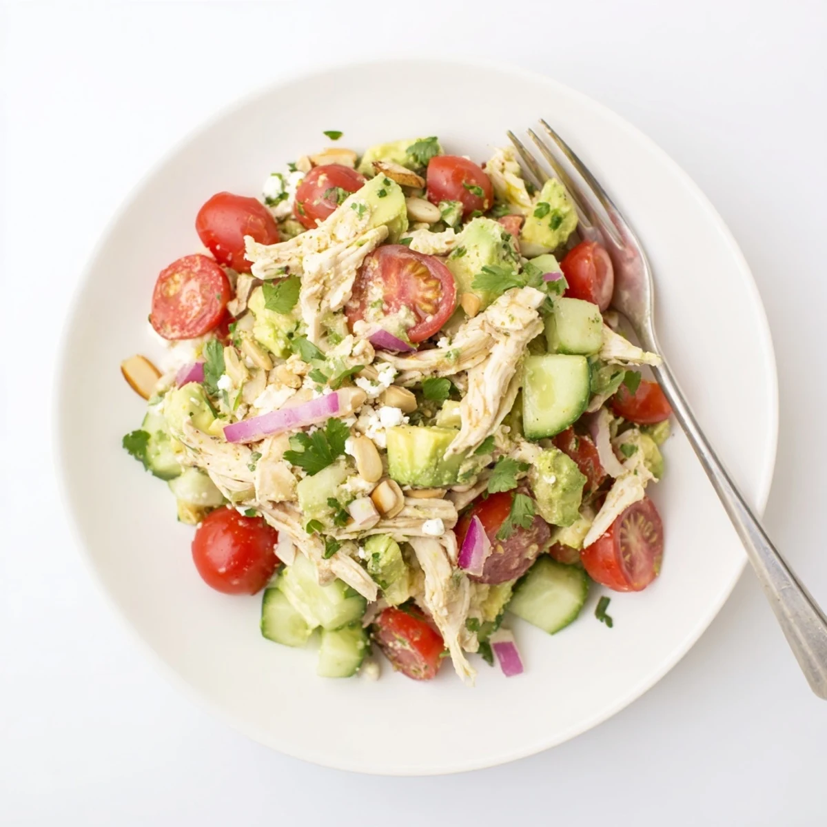 Silky Avocado Chicken Salad tossed with lime dressing, cherry tomatoes, cucumber