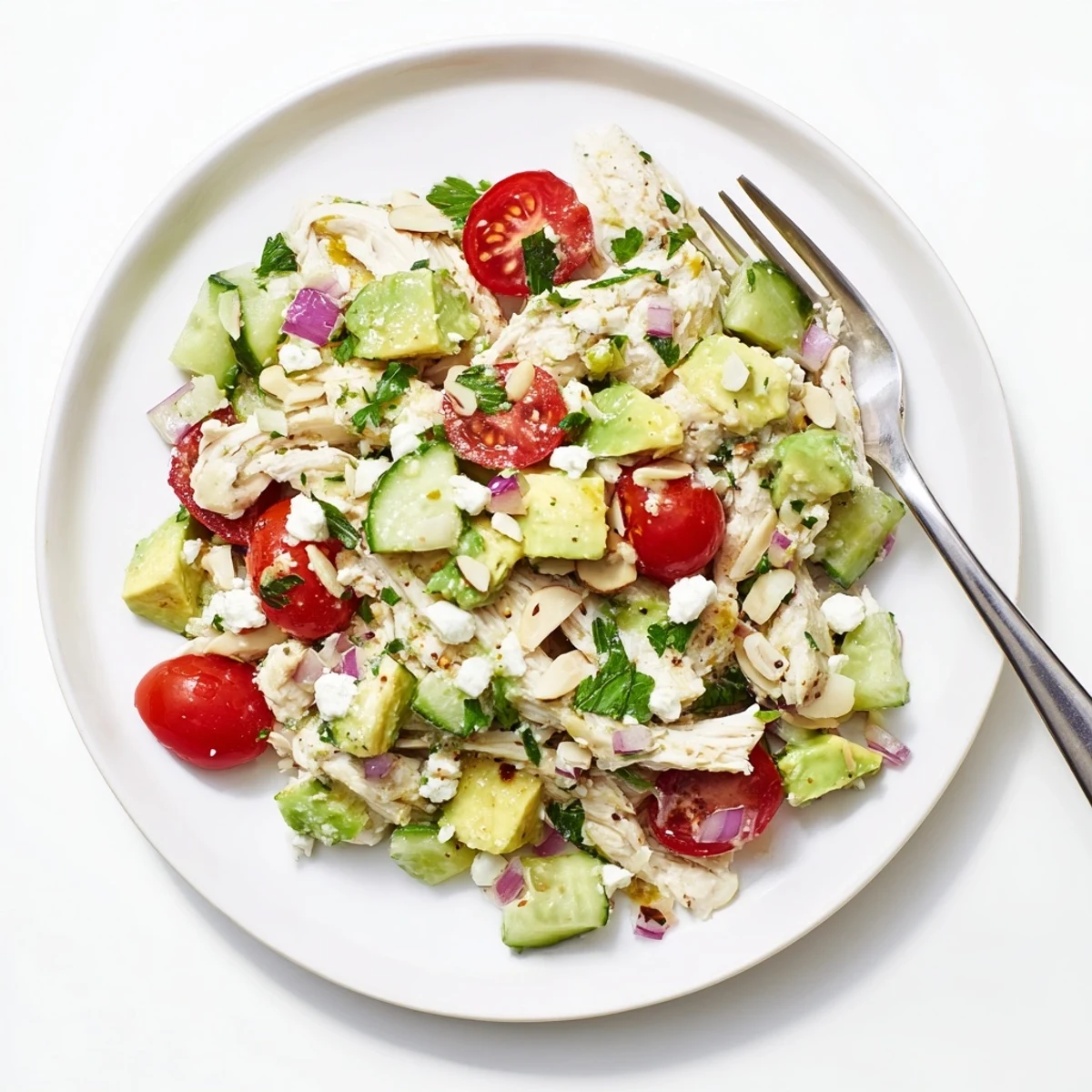 Bright Avocado Chicken Salad served in bowl, tender chicken, cilantro finish