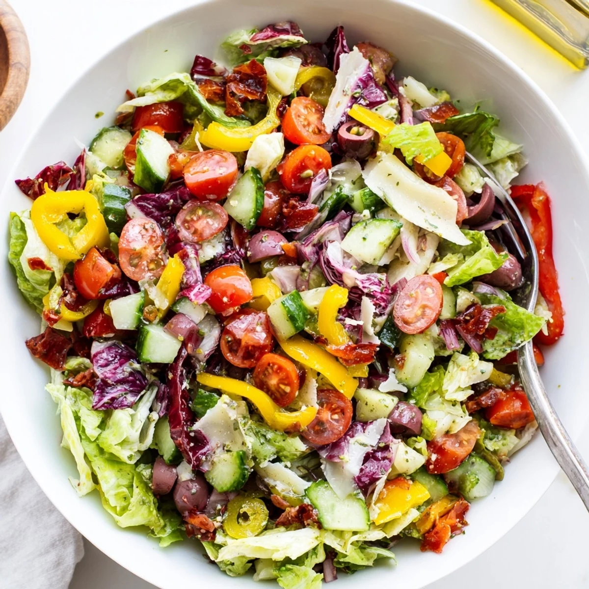 Zesty Italian Chopped Salad With Parmesan And Peppers piled in bowl, vibrant crunch