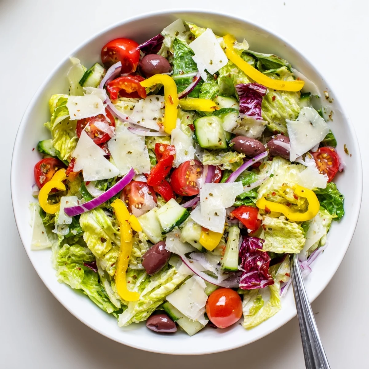 A serving of Zesty Italian Chopped Salad With Parmesan And Peppers with crusty bread