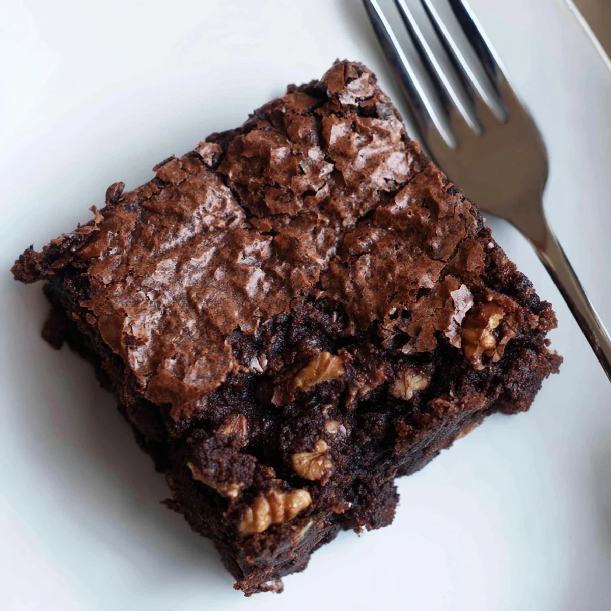 Rich chocolate brownies with nuts, served warm with vanilla ice cream
