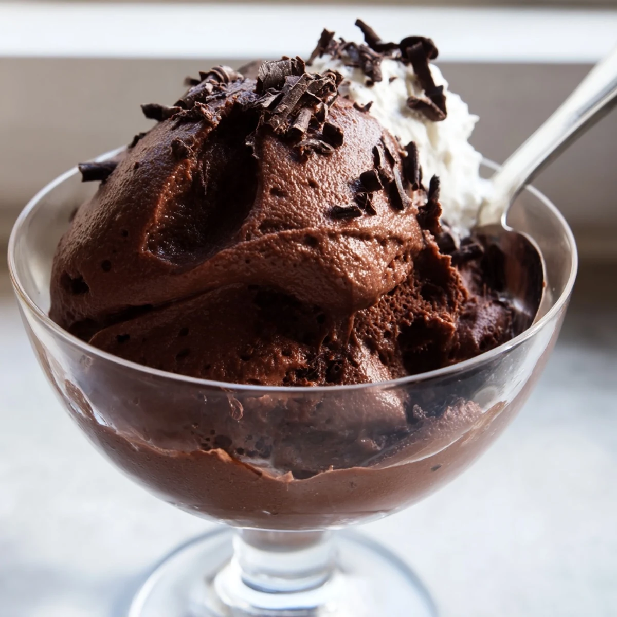 Silky chocolate mousse chilled to perfection garnished with cocoa dust and fresh berries