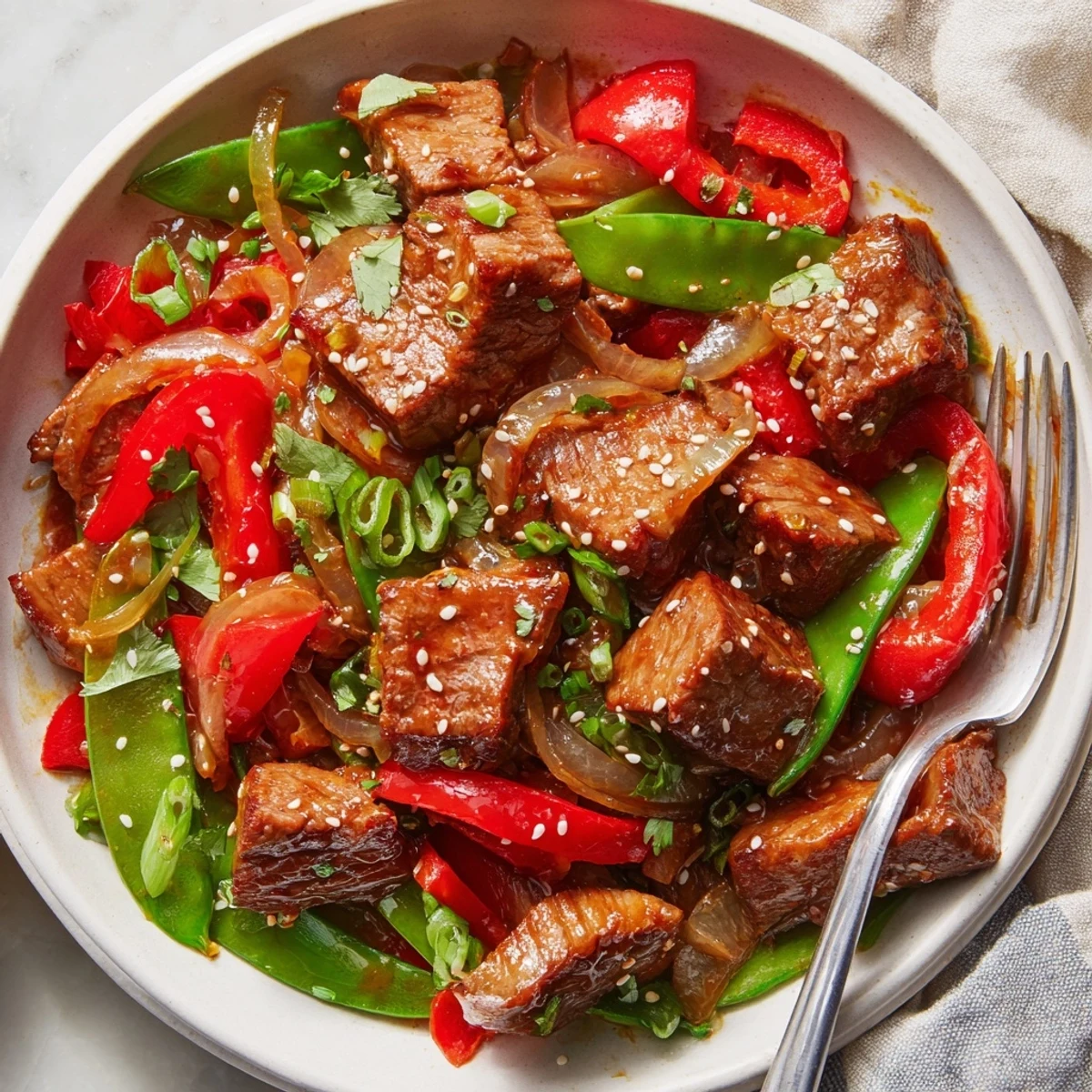 Asian-inspired cube steak glazed in soy ginger sauce with crisp colorful vegetables