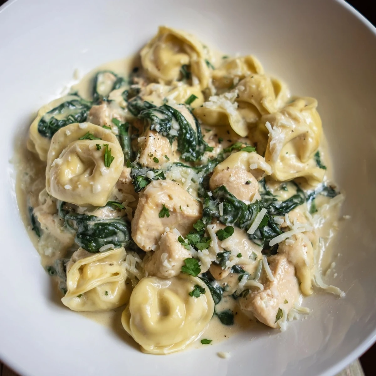 Creamy garlic chicken tortellini with spinach in a golden Parmesan sauce