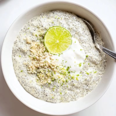 A chilled Key Lime Chia Pudding topped with coconut yogurt and zest