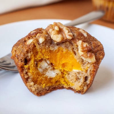 Butternut Squash Banana Muffins cooling on rack, nutty crumbs and steam